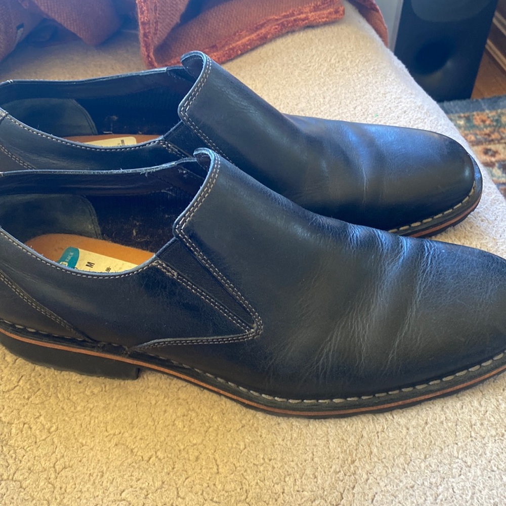 Black slip on shoes.